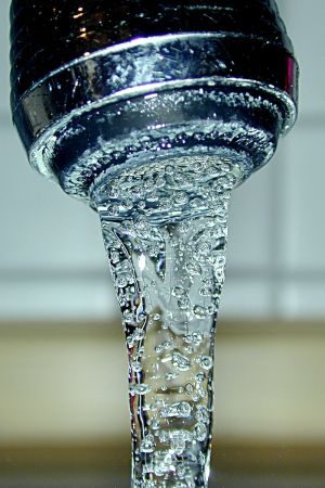 Water running from a tap, illustrative