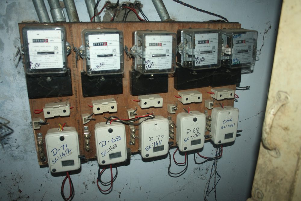 A bank of electricity meters, illustrative