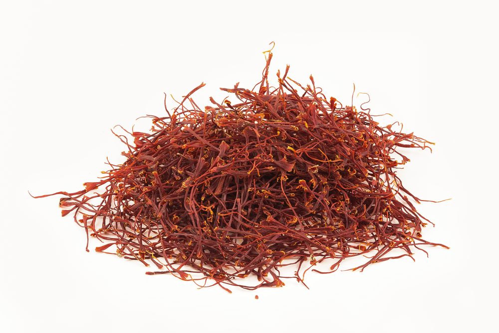Real saffron threads showing the deep red color and orange trumpet-shaped tips